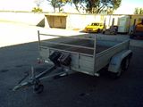 a trailer with a trailer attached to it in a parking lot