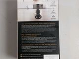 the box of the camera is open on a white surface