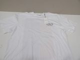 the shirt is white and has a small tag on it