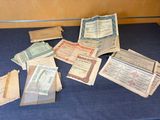 a lot of old paper money sitting on a blue table