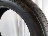 a close up of a tire on a white surface with a white background
