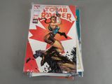 a stack of comic books sitting on top of a table