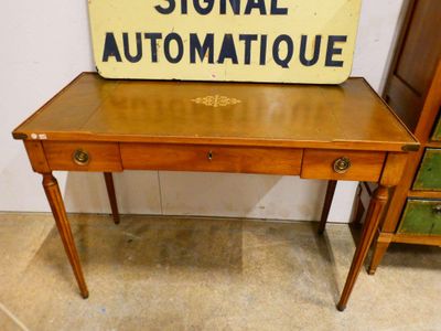 a wooden table with a sign on top of it
