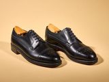 the black shoes are lined up and ready to be worn