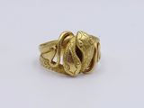 an image of a gold ring with a snake on it
