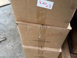 a stack of boxes sitting on top of each other on the floor