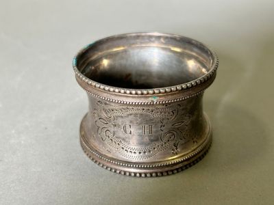 a silver cup that is sitting on a table