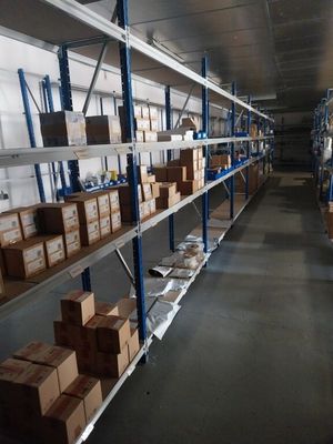 many boxes on the shelves in the warehouse