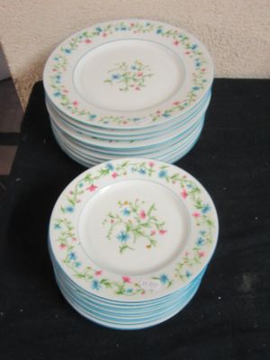 a lot of plates that are sitting on a table