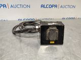 a picture of a black box with a cord attached to it