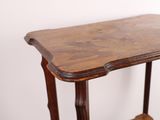 a small wooden table with a shelf on top of it