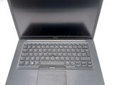 a laptop computer with a keyboard on the top of it