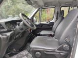the interior of a truck with a steering wheel and a seat