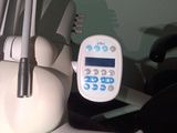 a remote control sitting on top of a dental chair