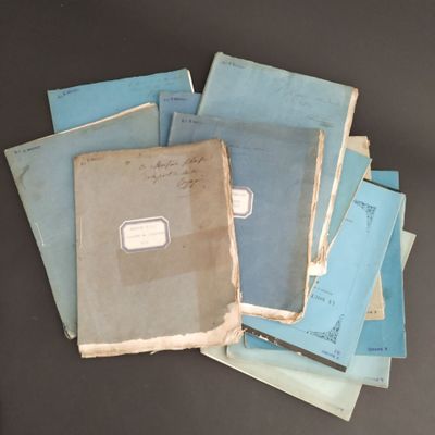 a pile of old papers sitting on a table