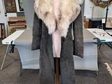 an image of a coat on a mannequin in a room