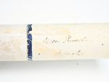 a baseball bat with writing on it sitting on a table