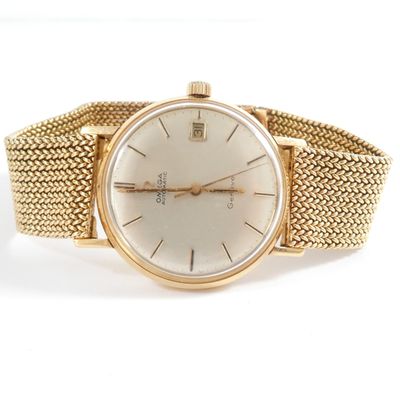 an image of a gold wrist watch with a white dial