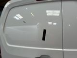 a white van that is parked inside of a building