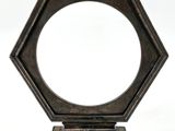 a close up of a mirror on a stand with a white background