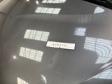 a picture of a car with a sticker on it ' s hood