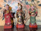 three figurines that are sitting on a table