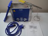 an image of a blue and silver waxing machine on a white table