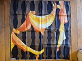 a banana hanging on a wall in a room
