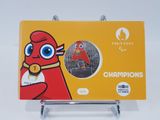 a card with a picture of a red bird holding a gold medal