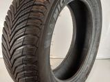 a close up of a tire on a white surface