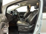 the interior of a car with the door open and the passenger seat down
