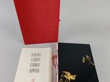 two books sitting next to each other on top of a table