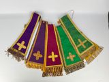 four different colored stoles with crosses and crosses on them