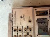 an old electronic device that is sitting on the floor