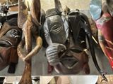 many different types of masks on display in a store