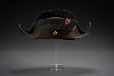 an image of a hat on a clear stand with a black background