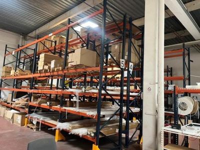 a large warehouse filled with lots of shelves and pallets