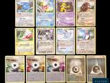 a lot of pokemon cards that are on the table