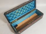 a small wooden box with a blue and yellow design