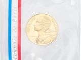 a gold coin with a red, white, and blue stripe around it