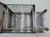 an image of a metal basket with a handle on it