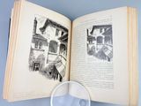 an open book with a magnifying glass on top of it