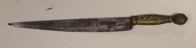 a knife that is laying on a white surface
