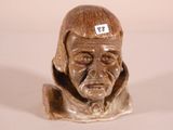 a statue of a man with a sticker on his head