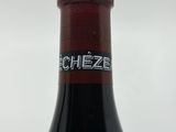 a bottle of wine that is sitting on a table