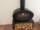 a wood burning stove in the corner of a room