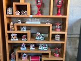 a wooden shelf with a lot of christmas decorations on it