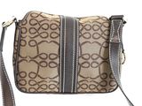 the brown and black handbag is sitting on a white surface