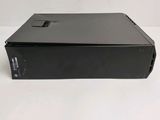 the back of a black computer case sitting on a white surface