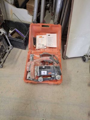 a tool kit sitting in a case on the floor